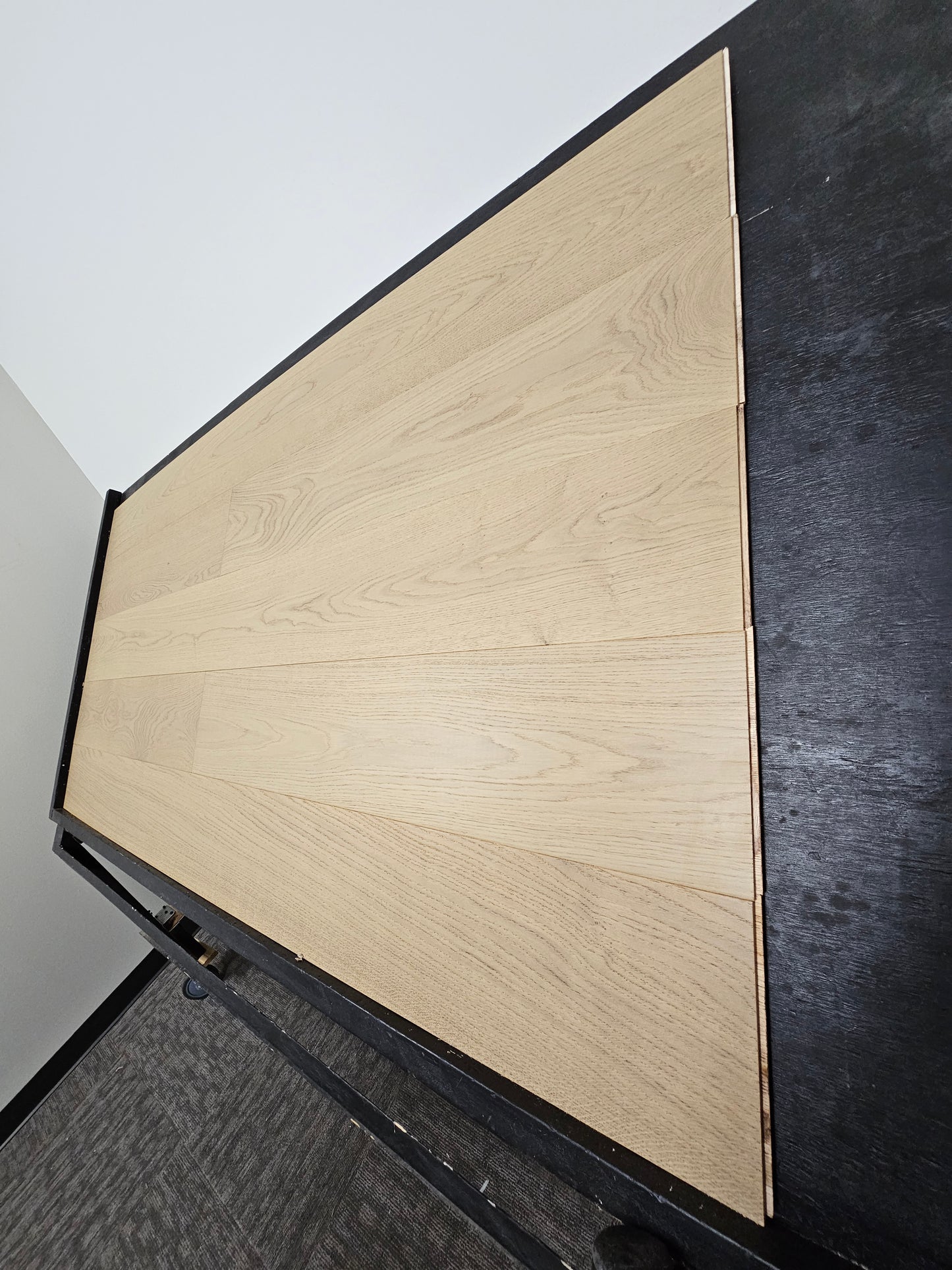8 5/8" x 5/8" Engineered European White Oak Log Haven Hardwood Flooring on a black shooting rack right hand side shot