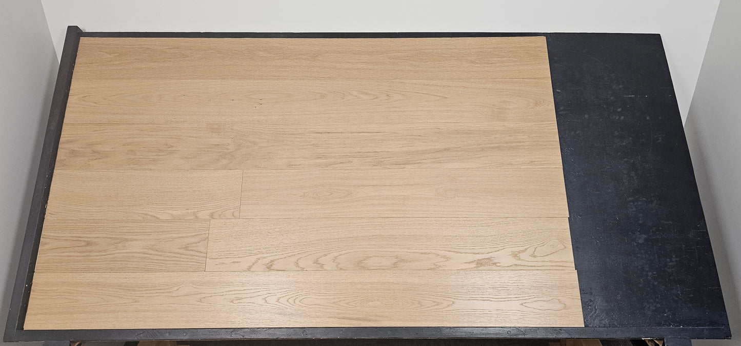 7 1/2" x 1/2" Engineered European Oak Rosy Shores Stain Hardwood Flooring Shown on a black shooting table
