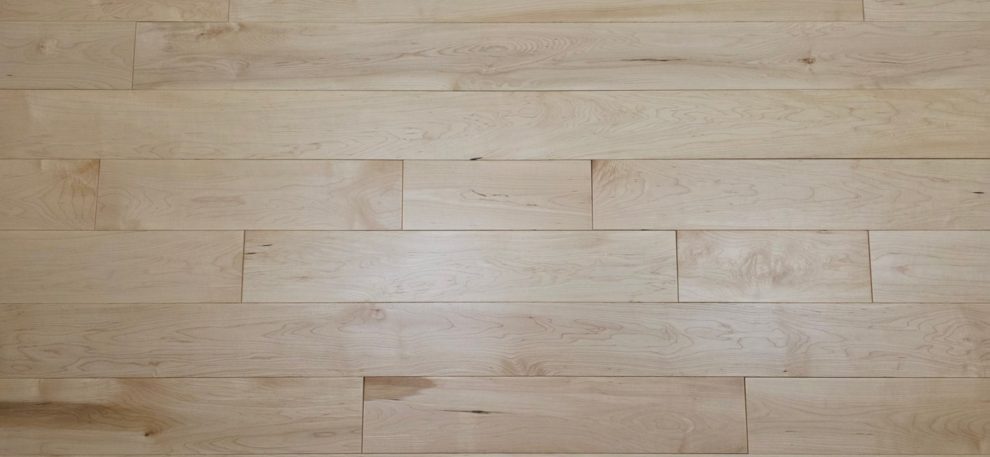 Maple HardWood flooring with a light brown color and visible grain pattern.