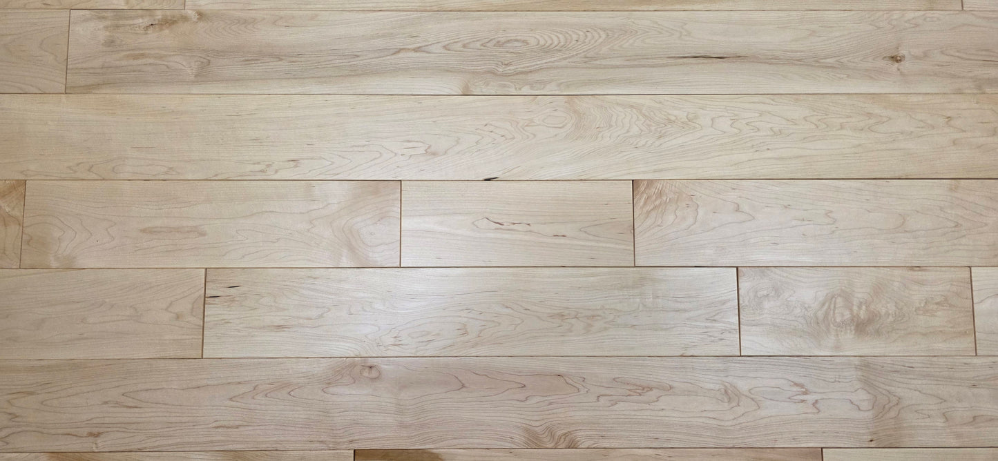 Maple HardWood flooring with a light brown color and visible grain pattern.