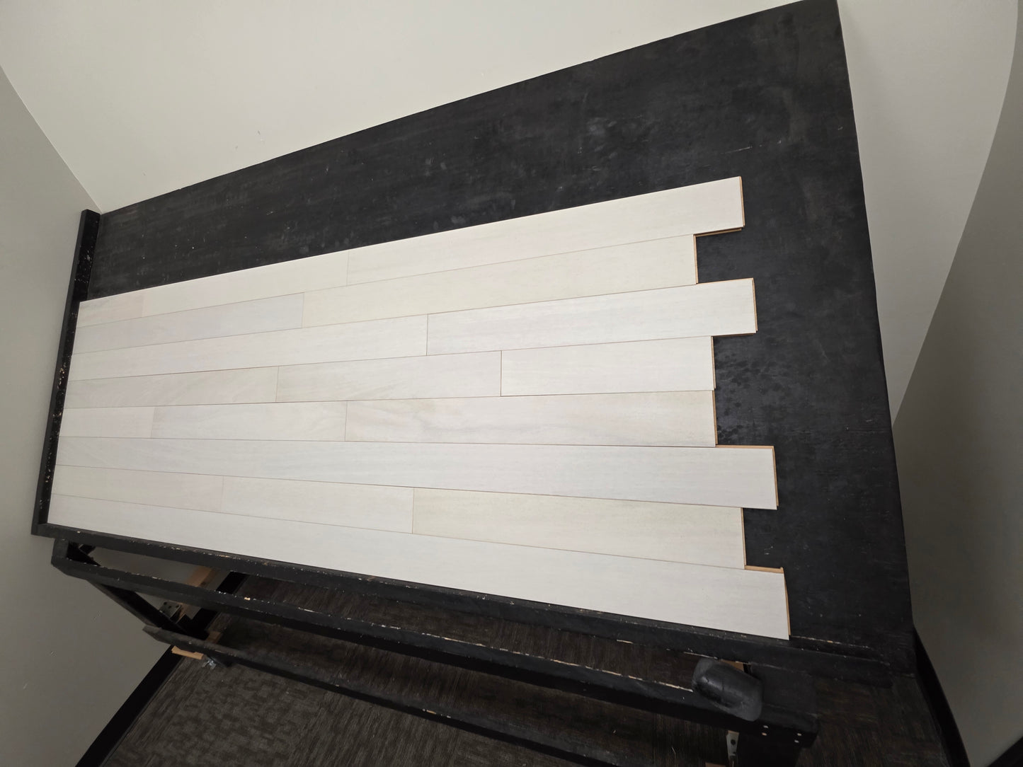 4" x 3/4" Solid Brazilian Oak Urso Hardwood Flooring on a black shooting table, right angle shot.