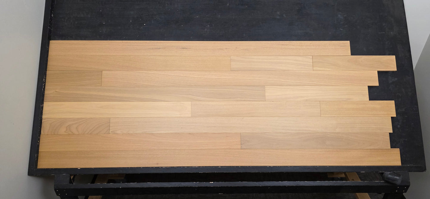 4" x 3/4" Solid Brazilian Oak Natural Hardwood Flooring straight on shot on black shooting rack