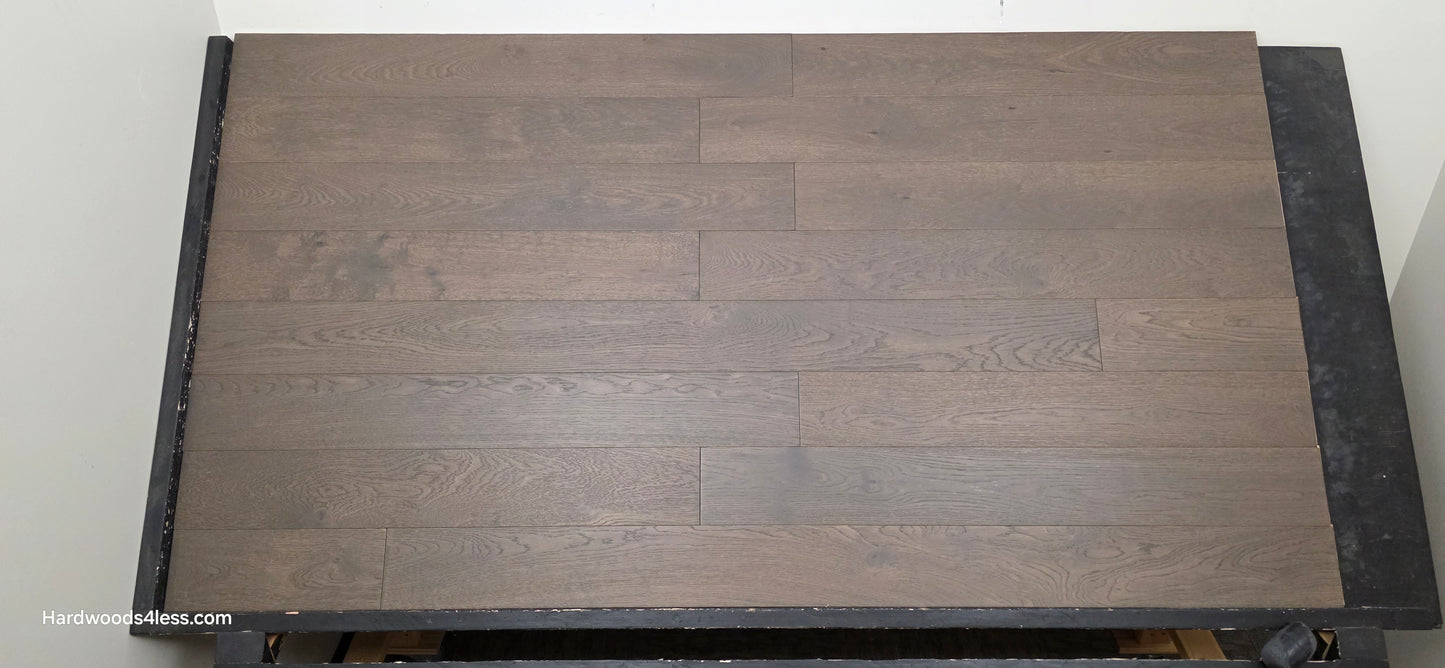 5 7/8" x 9/16" Engineered European Oak Mount Mitchell Hardwood Flooring. Shown on a black shooting table. Front shot.
