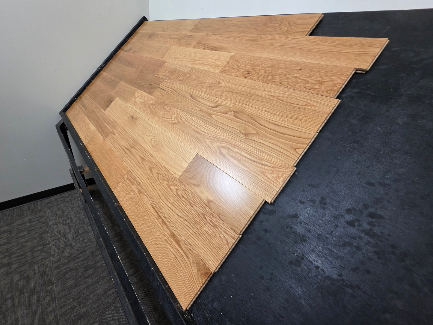Wooden flooring panels on a black and white background