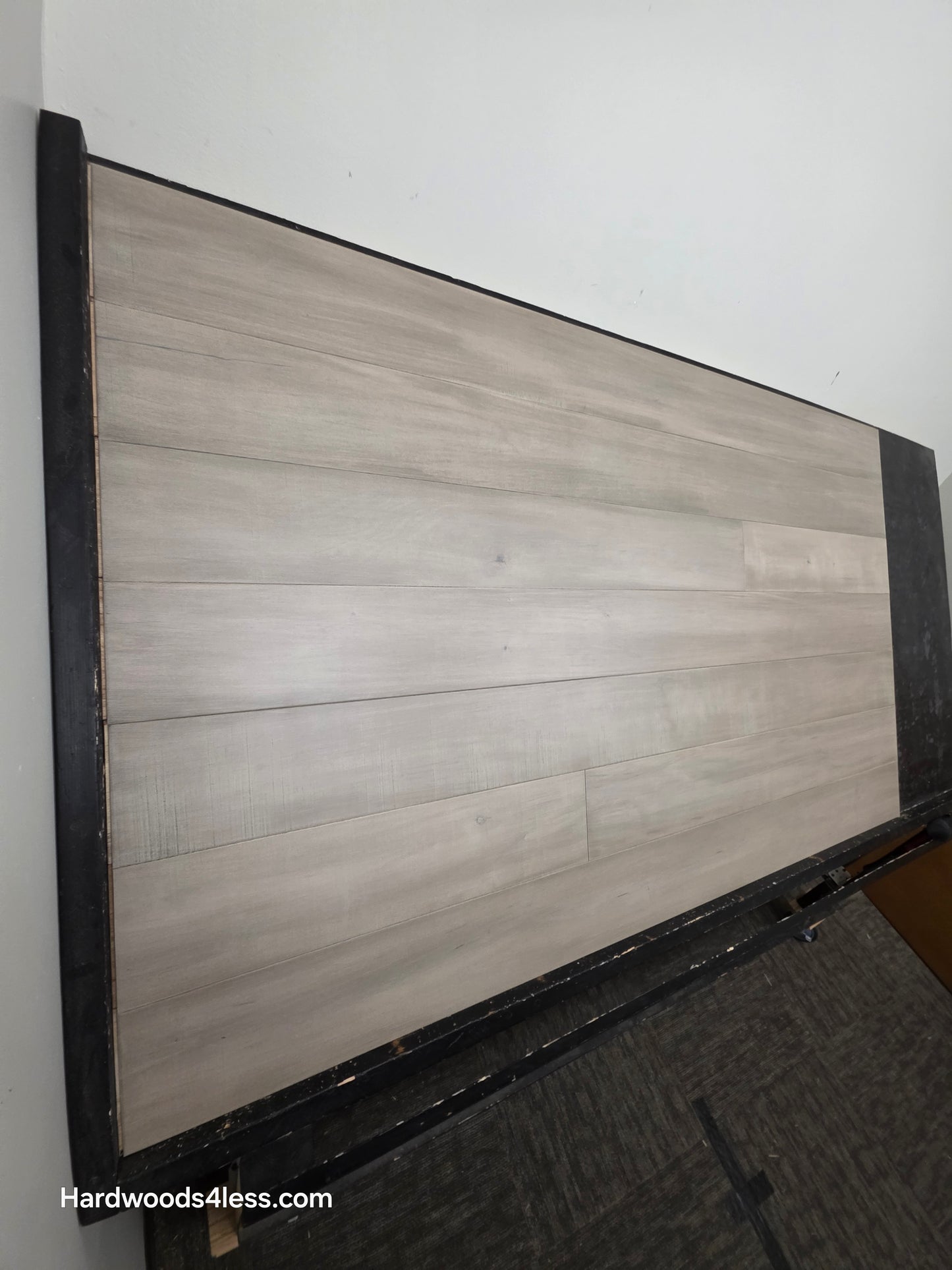 6 1/2" x 1/2" Engineered Maple Polar Palace Hardwood Flooring shown on a black shooting table.
