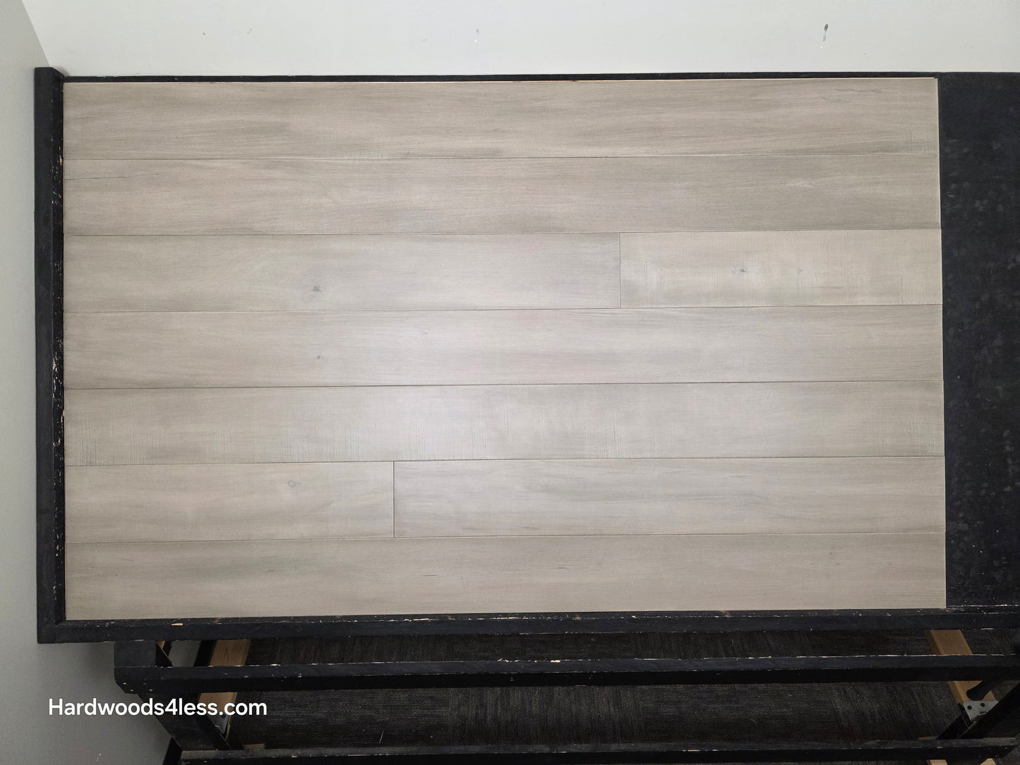 6 1/2" x 1/2" Engineered Maple Polar Palace Hardwood Flooring shown on a black shooting table.