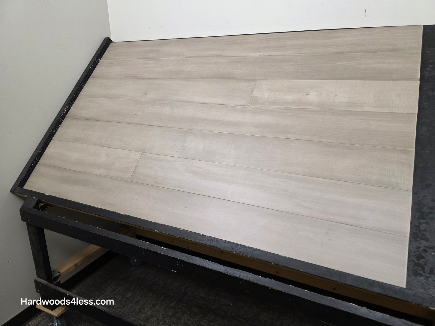 6 1/2" x 1/2" Engineered Maple Polar Palace Hardwood Flooring shown on a black shooting table.