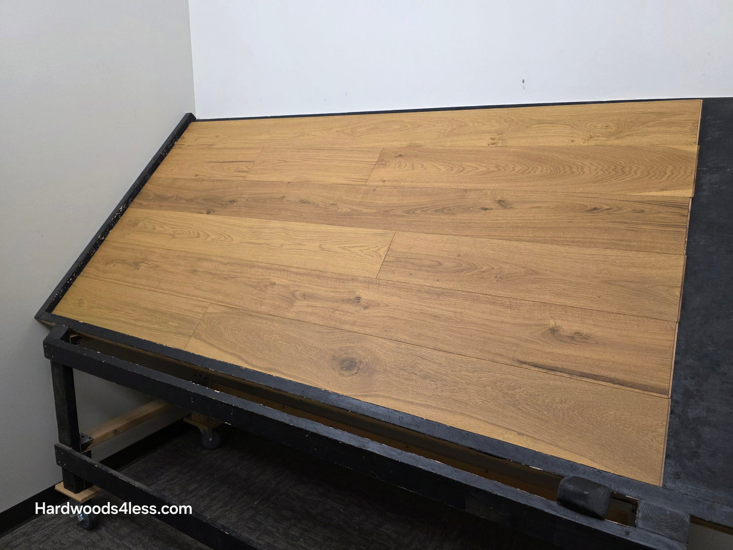 7 1/2" x 9/16" Engineered European Oak Rathlin Hardwood Flooring shown on a black shooting rack. Shot from the right side.