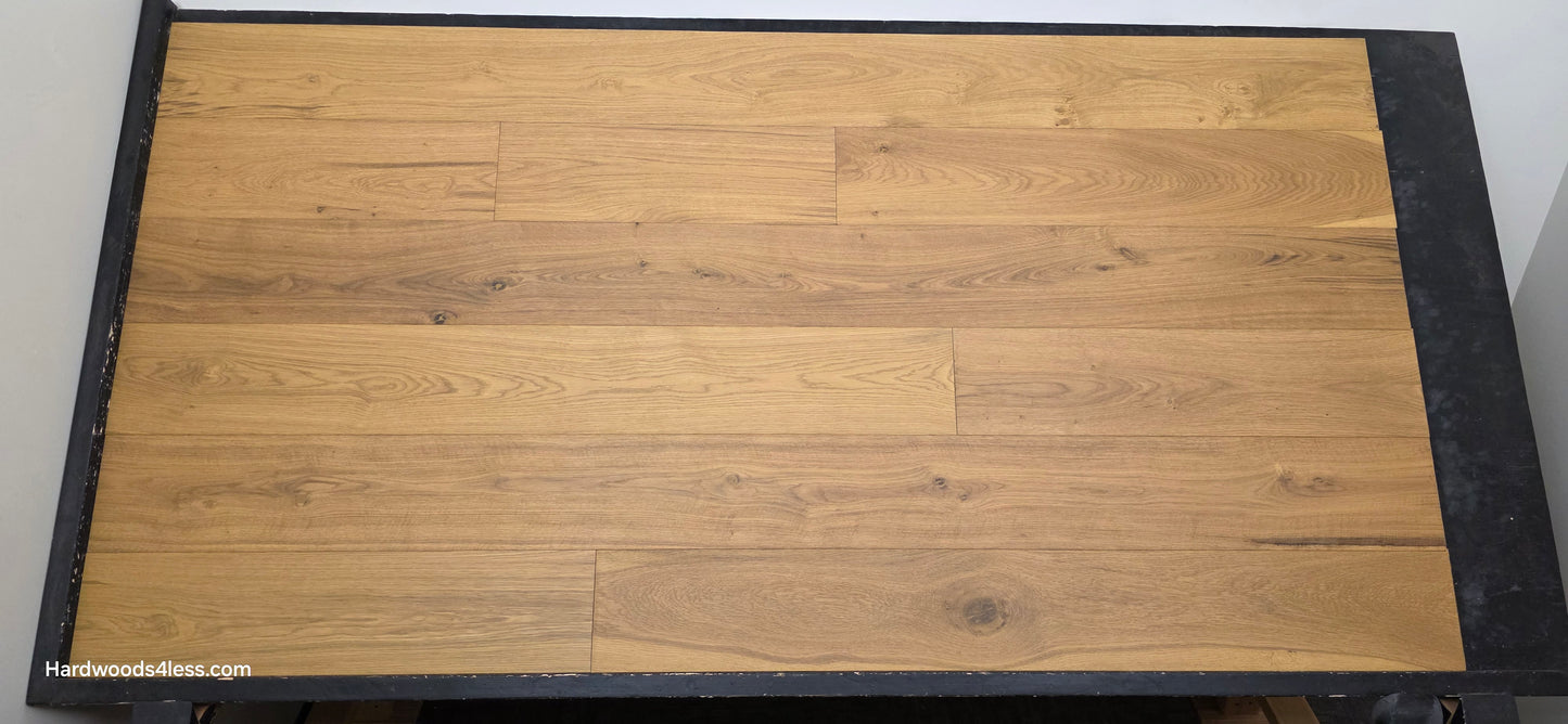 7 1/2" x 9/16" Engineered European Oak Rathlin Hardwood Flooring shown on a black shooting rack. Shot from center.