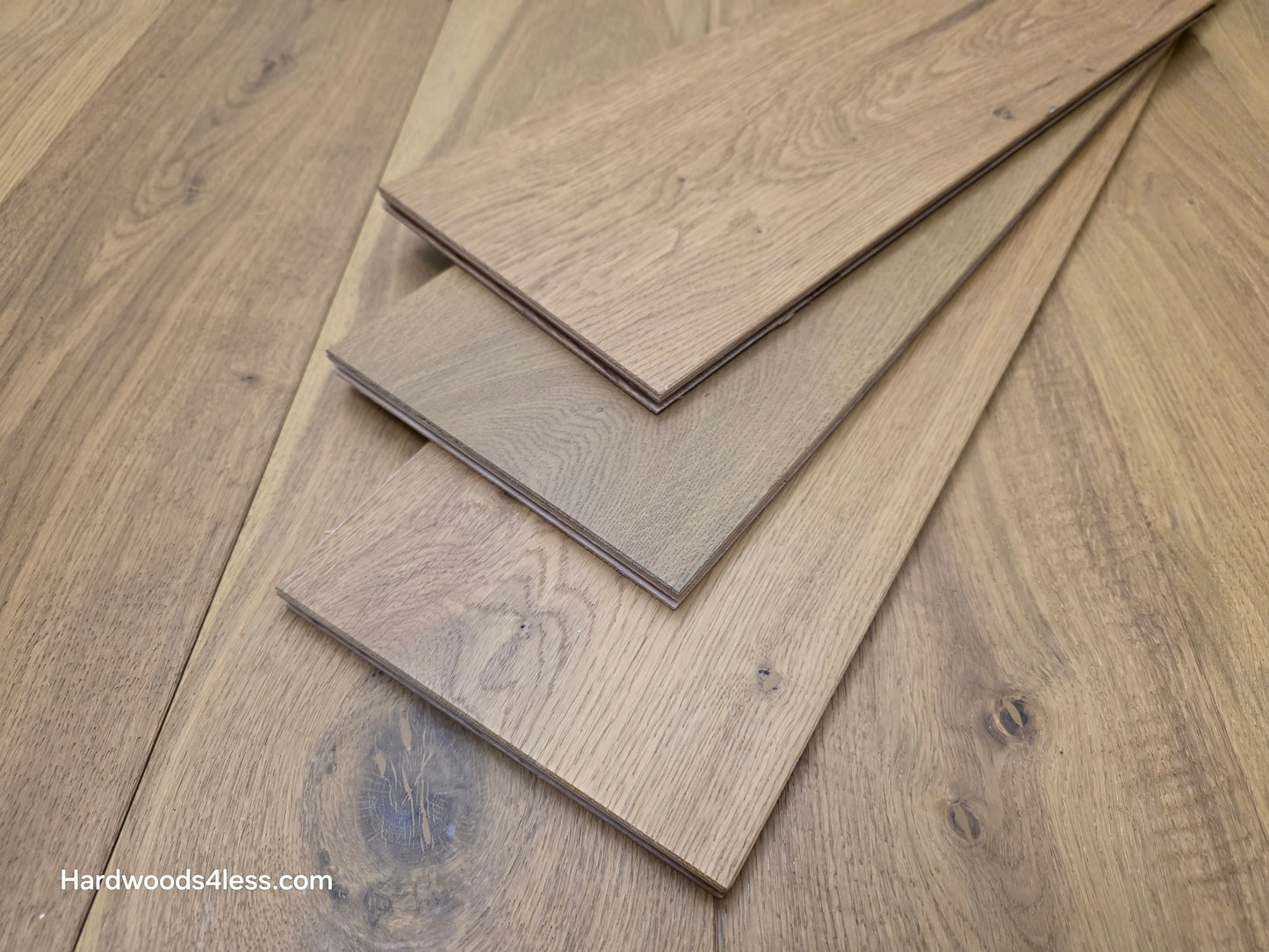 7 1/2" x 9/16" Engineered European Oak Rathlin Hardwood Flooring close up of three boards stacked on the floor.