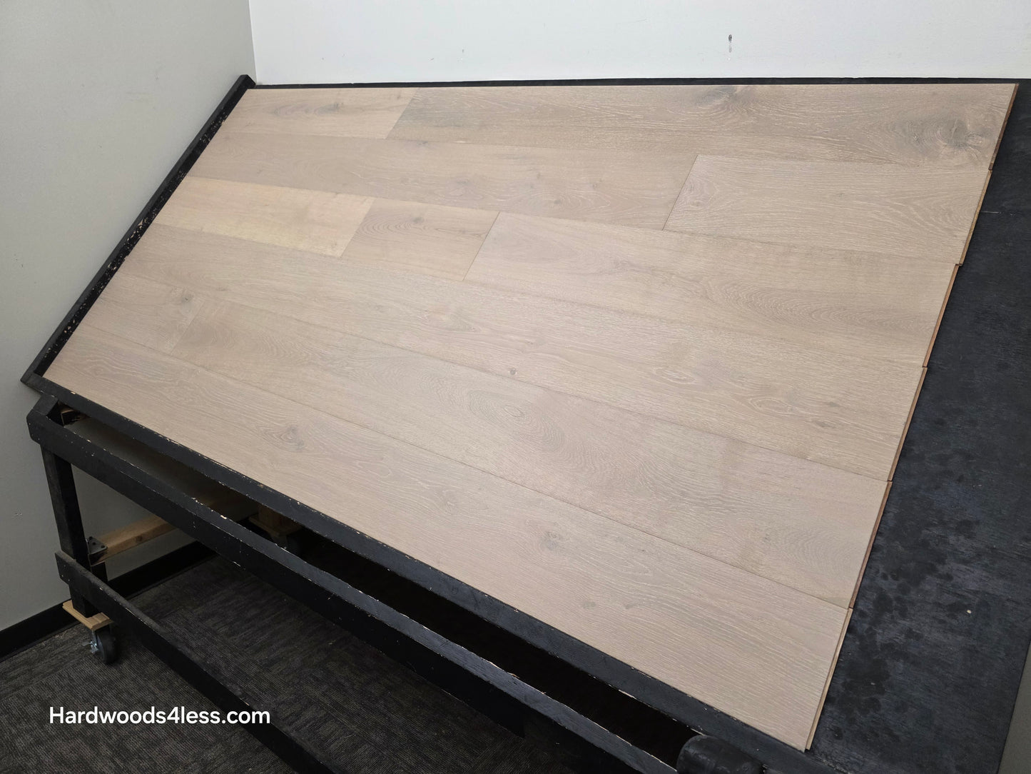 7 1/2" x 9/16" Engineered European Oak Sark Hardwood Flooring shown on a black shooting table. Shot from the right side.