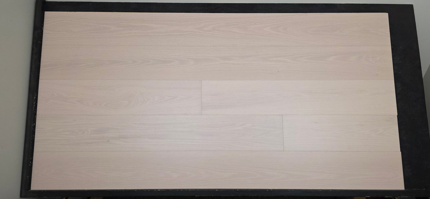 Engineered European Oak Antenne Hardwood Flooring wide front shot on a black table