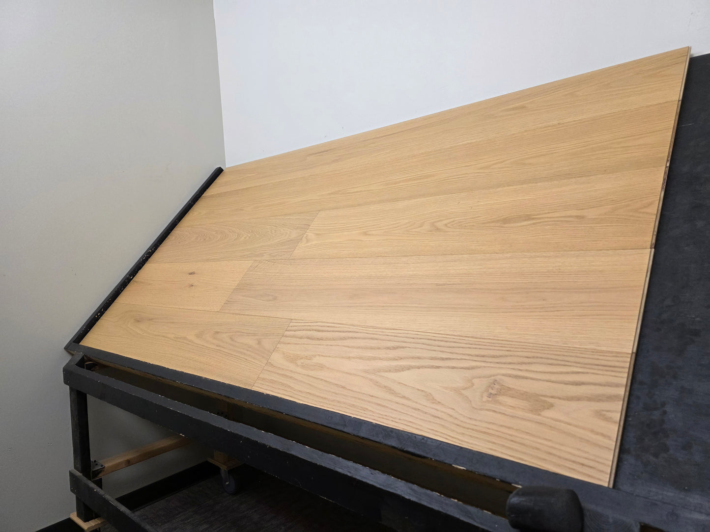 9 1/2" x 5/8" Engineered Red Oak Oberon Hardwood Flooring right handed shot steep angle on a black board
