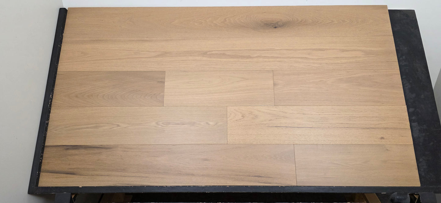 9 12 x 58 Engineered Red Oak Phoebe Hardwood Flooring on a black shooting table.