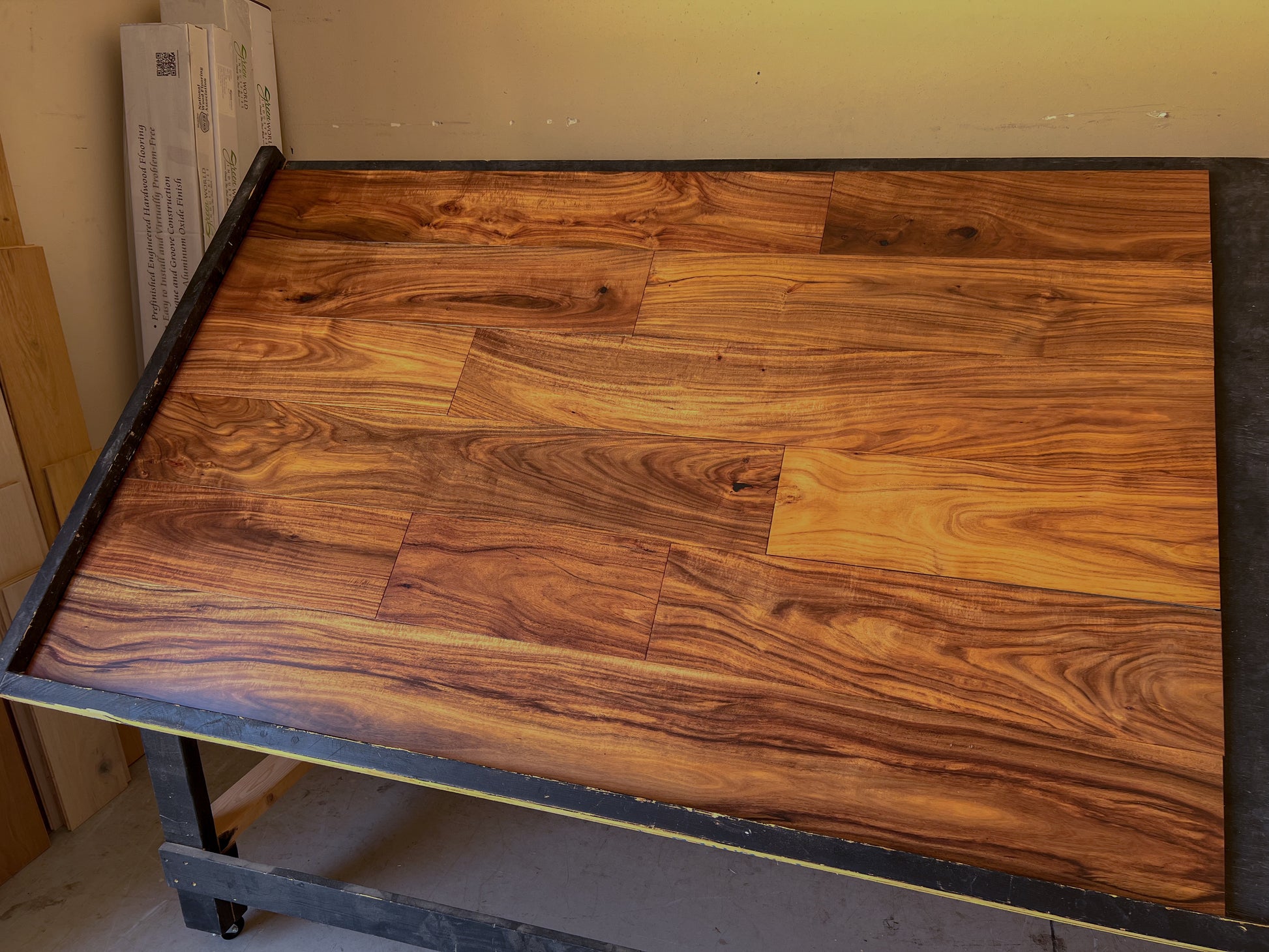 7 1/2" x 1/2" Engineered Acacia Botticelli Hardwood Flooring shown on a black shooting rack. right hand side shot