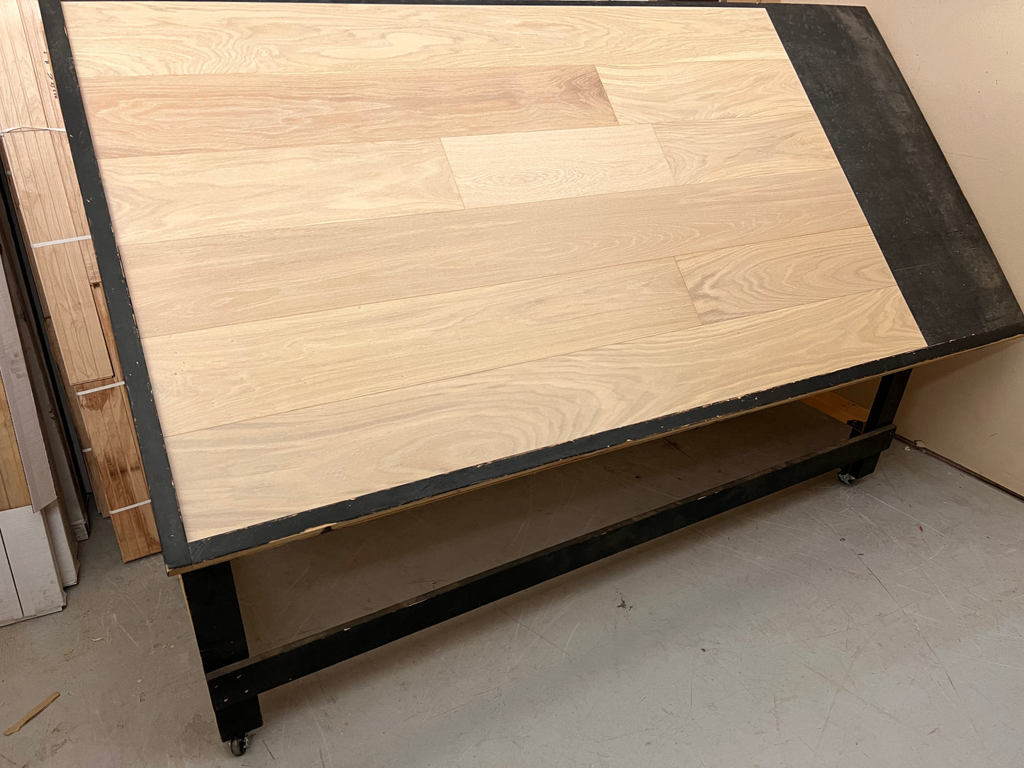 7 1/2" x 3/4" Engineered European Oak Willamette (Giona-S) Hardwood Flooring. Show on a black shooting table. Shot from wide left.