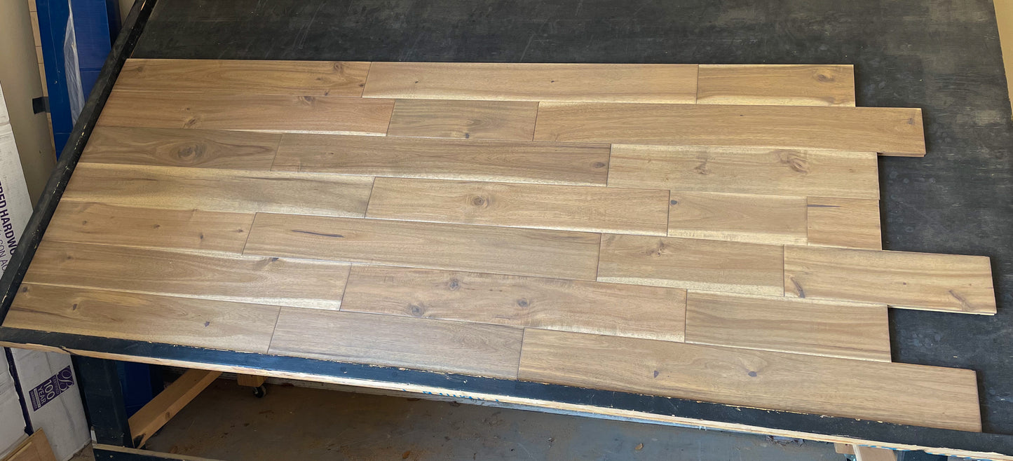5" x 3/4" Asian Walnut Driftwood Hardwood Flooring on a black shooting table wide front shot