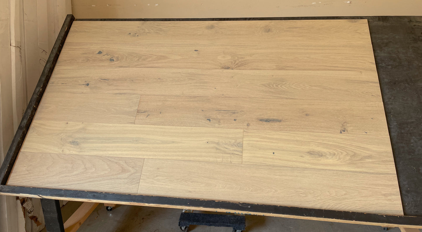 7 1/2" x 1/2" Engineered European Oak Morro Stain Hardwood Flooring shown on a black shooting table