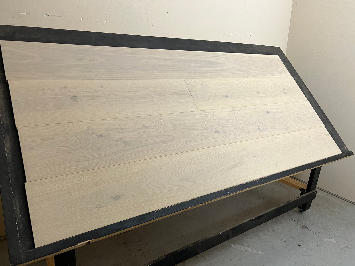 10.25" x 5/8" Engineered European Oak Blanton Hardwood Flooring on a black shooting table