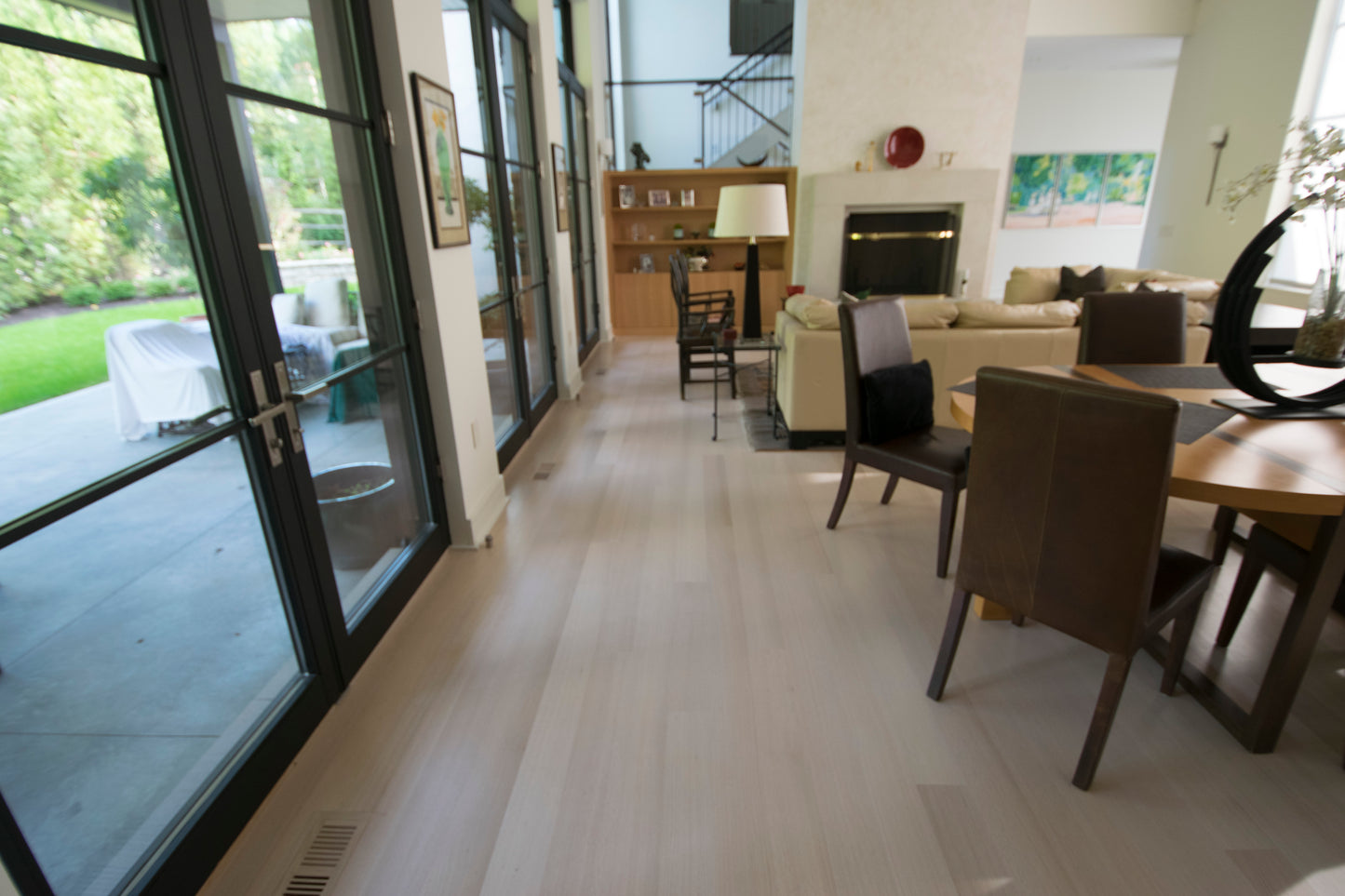 4" x 3/4" Unfinished Northern Oak Rift Only Hardwood Flooring. Lots of chairs and couches atop it