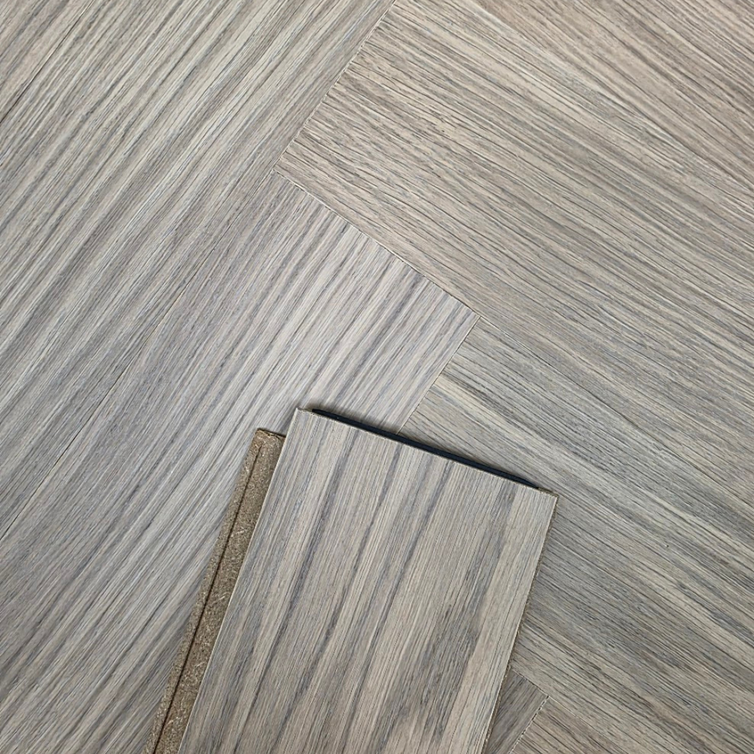 A picture of our modernized hardened engineered hardwood flooring. Shown as a single plank over a floor. Highlighting the 5g dry click and lock rail