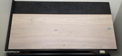 10.67" x 7/16" Modernized Engineered European Oak Corbusier Hardened Hardwood Flooring. Shown on a black shooting table. Shot from center.