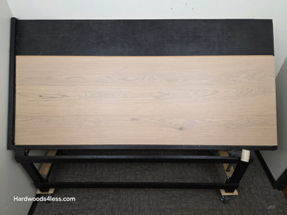 10.67" x 7/16" Modernized Engineered European Oak Foster Hardwood Flooring. Shown on a black shooting table. Shot from center. This is a Laminate look alike. 