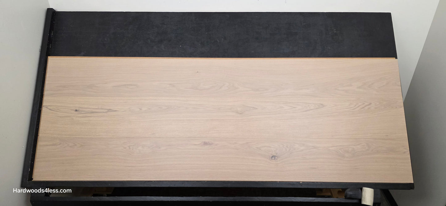 10.67" x 7/16" Modernized Engineered European Oak Foster Hardwood Flooring. Shown on a black shooting table. Shot from center. This is a Laminate look alike. 