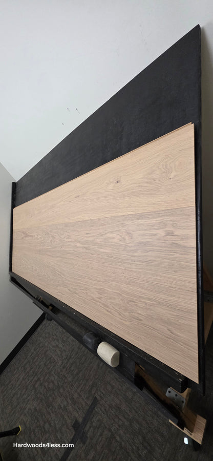 10.67" x 7/16" Modernized Engineered European Oak Gropius Hardened Hardwood Flooring. Shown on a black shooting table. Shot from steep right. 