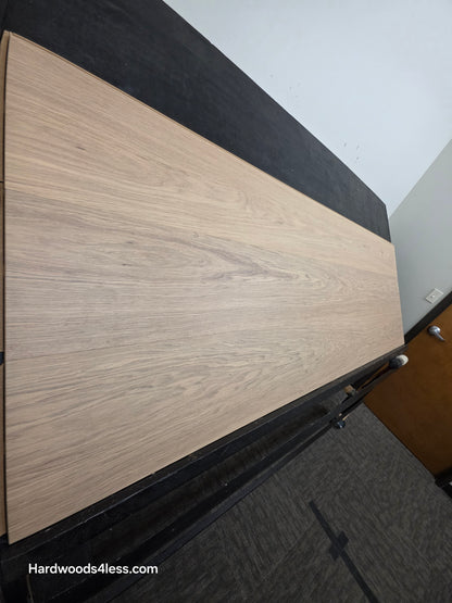10.67" x 7/16" Modernized Engineered European Oak Gropius Hardened Hardwood Flooring. Shown on a black shooting table. Shot from steep left.