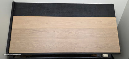 10.67" x 7/16" Modernized Engineered European Oak Gropius Hardened Hardwood Flooring. Shown on a black shooting table. Shot from center.