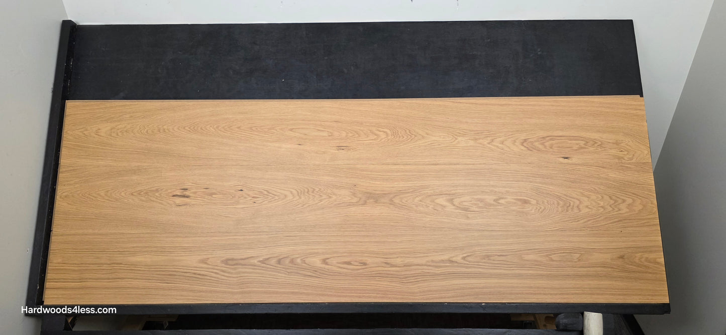 10.67" x 7/16" Modernized Engineered European Oak Hadid Hardened Hardwood Flooring.  Shown on a black shooting table. Shot from center. 