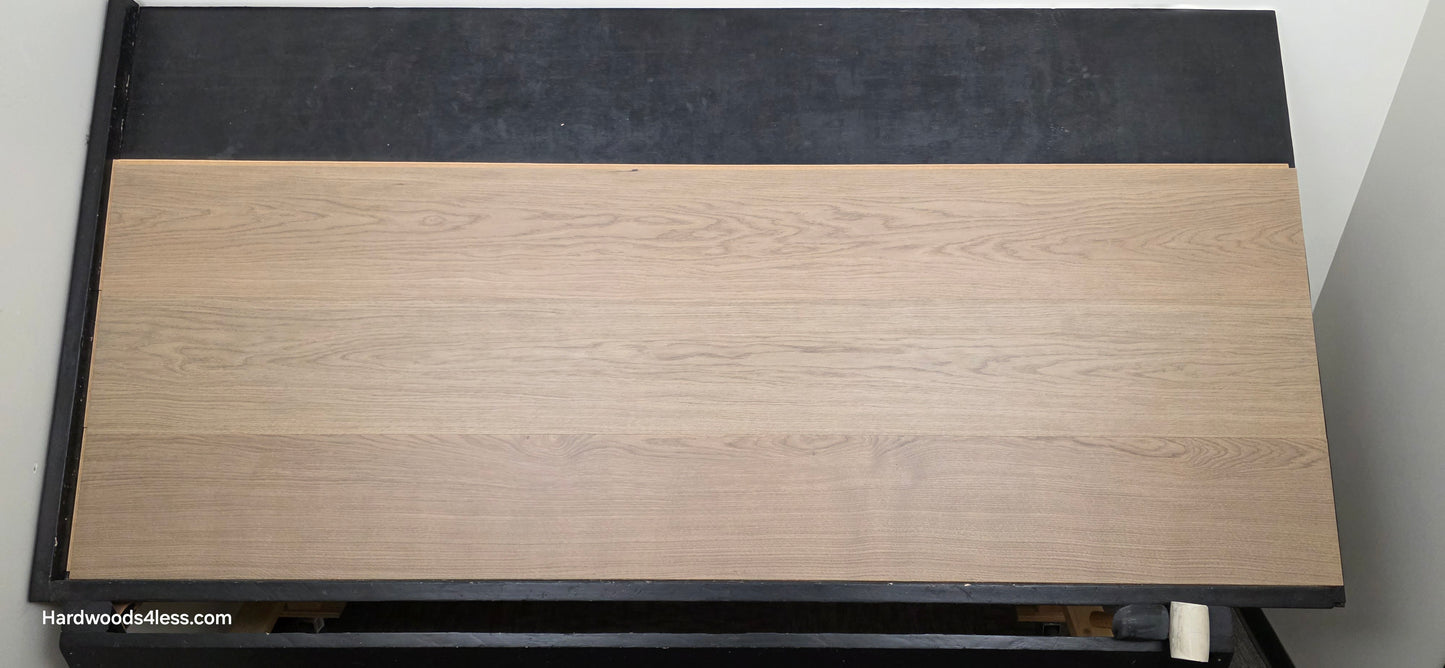 10.67" x 7/16" Modernized Engineered European Oak Khan hardened Hardwood Flooring. Shown on a black shooting table. Shot from Center.