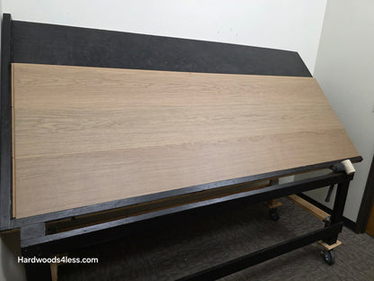 10.67" x 7/16" Modernized Engineered European Oak Khan hardened Hardwood Flooring. Shown on a black shooting table. Shot from wide left.