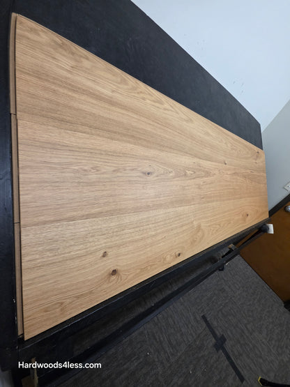 10.67" x 7/16" Modernized Engineered European Oak Wright Hardened Hardwood Flooring. Shown on a black shooting table. Shot from steep left.