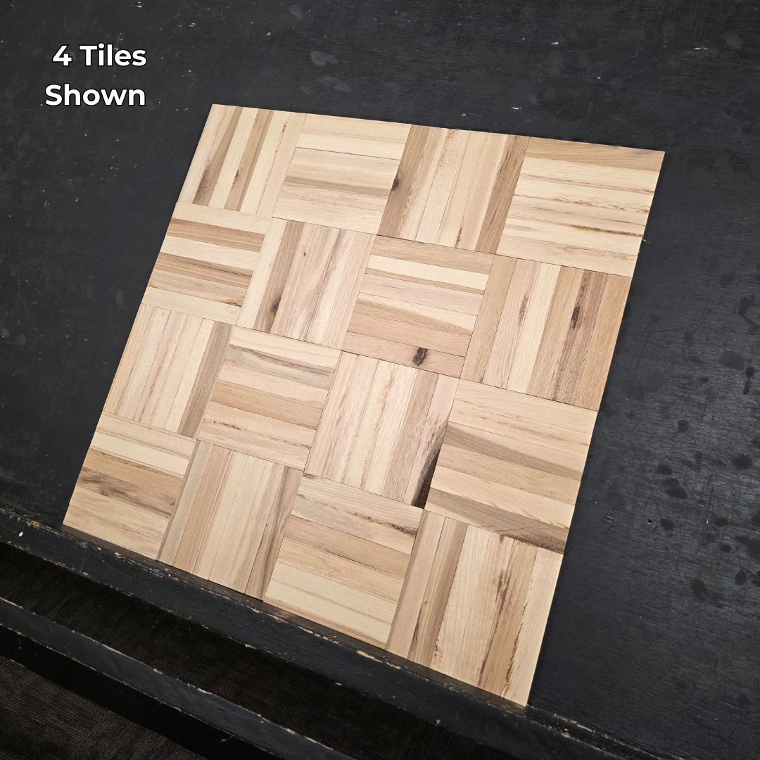 11" x 11" x 5/16" Unfinished Hickory 6-slat Parquet Hardwood Flooring. Shown on a black shooting table. Close up of 4 tiles.