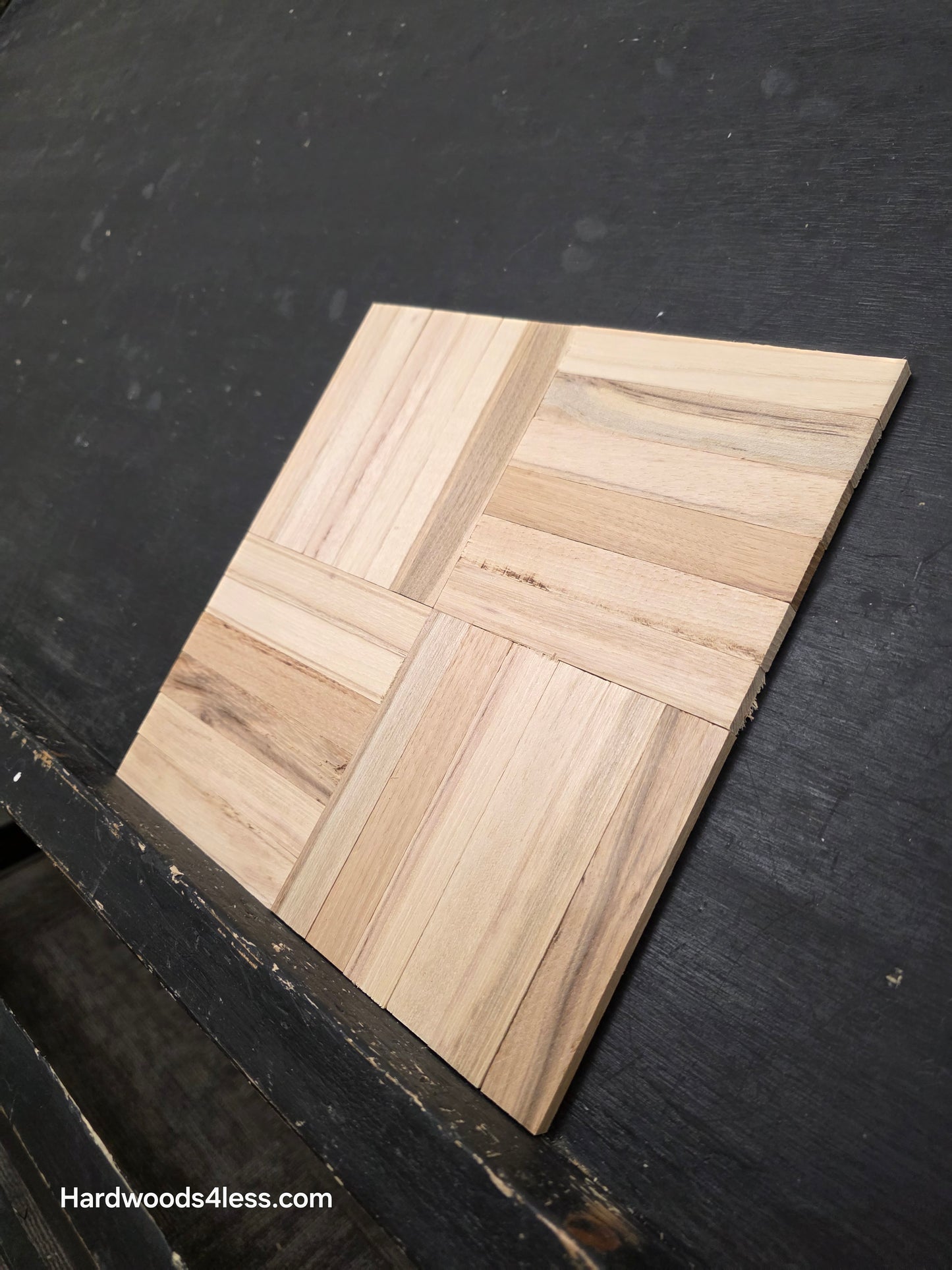 11" x 11" x 5/16" Unfinished Hickory 6-slat Parquet Hardwood Flooring. Shown on a black shooting table. Close up wide right.
