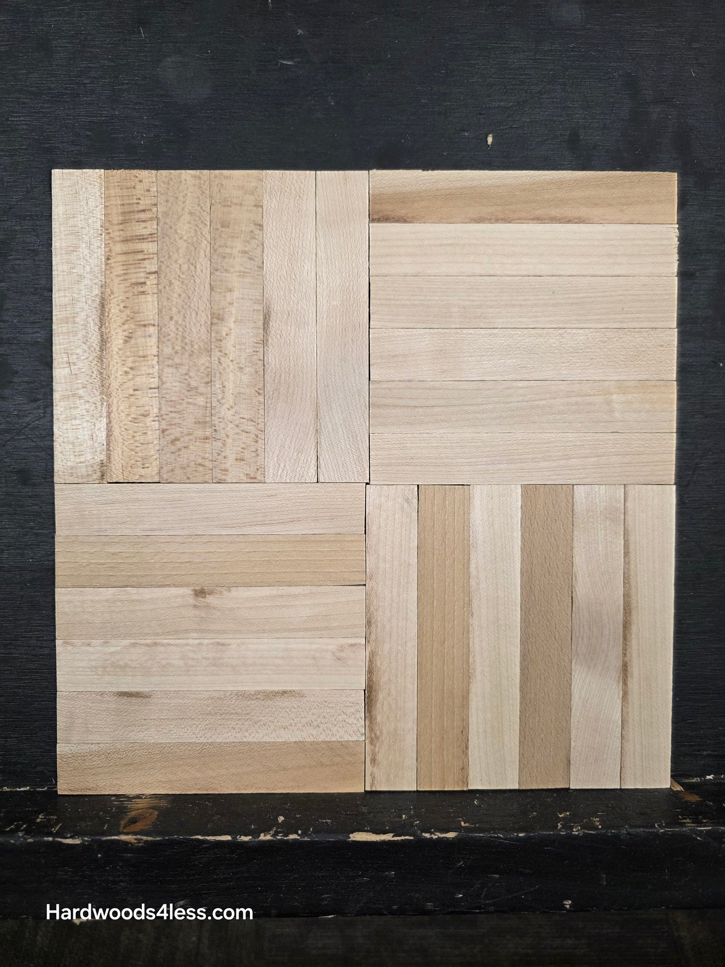11" x 11" x 5/16" Unfinished Maple 6-slat Parquet Hardwood Flooring. Shown on a black shooting table. 