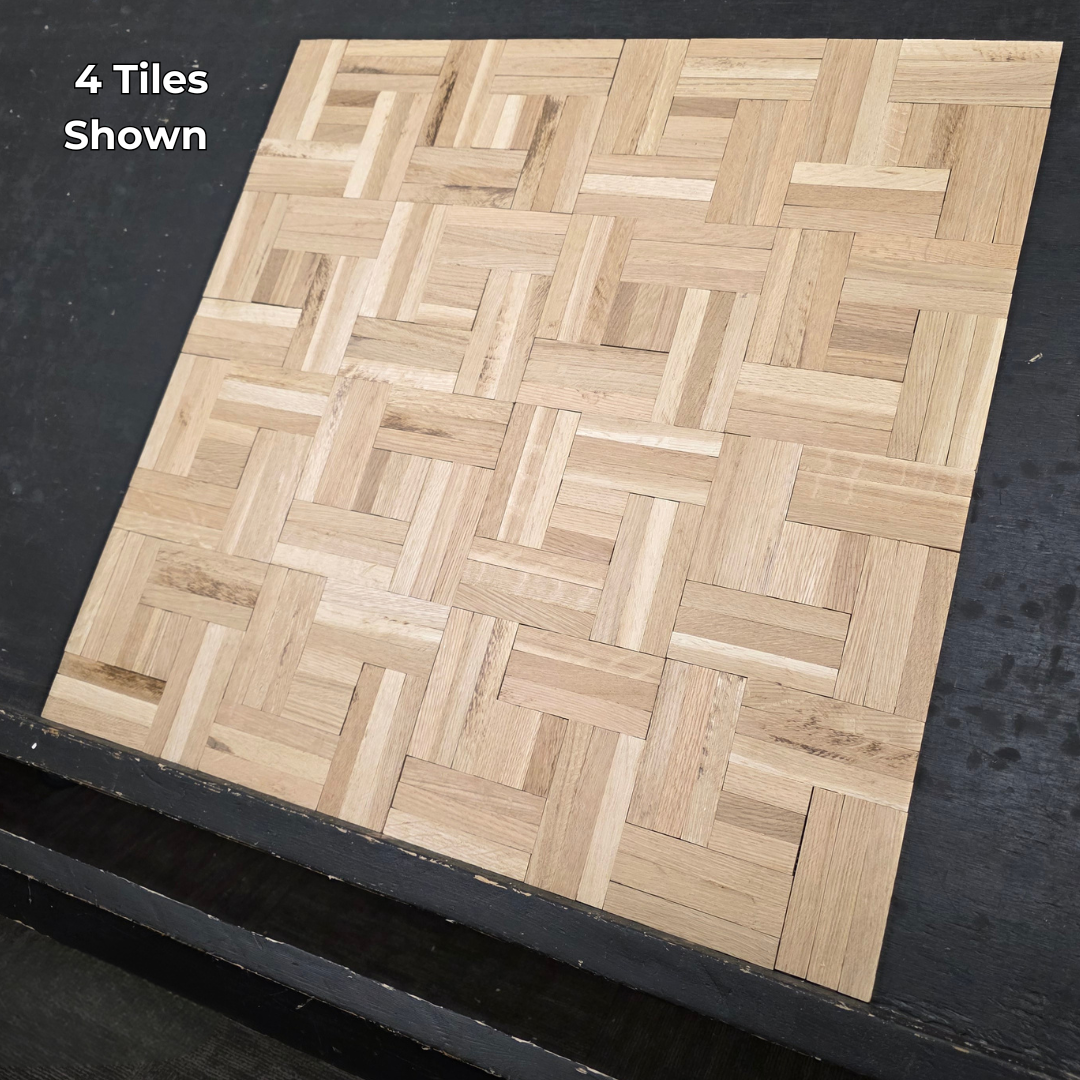 14 ¼ x 14 ¼ x 5/16 Unfinished White Oak Haddon Hall Parquet Flooring. Shown on a black shooting table. Close up steep right shot of 4 tiles. 