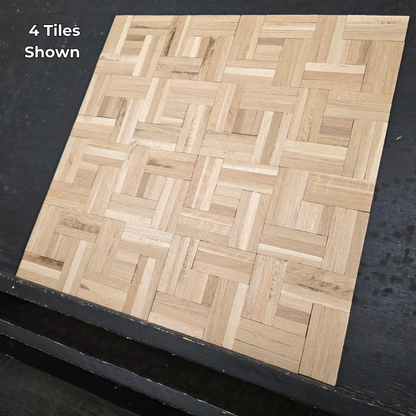 14 ¼ x 14 ¼ x 5/16 Unfinished White Oak Haddon Hall Parquet Flooring. Shown on a black shooting table. Close up steep right shot of 4 tiles. 