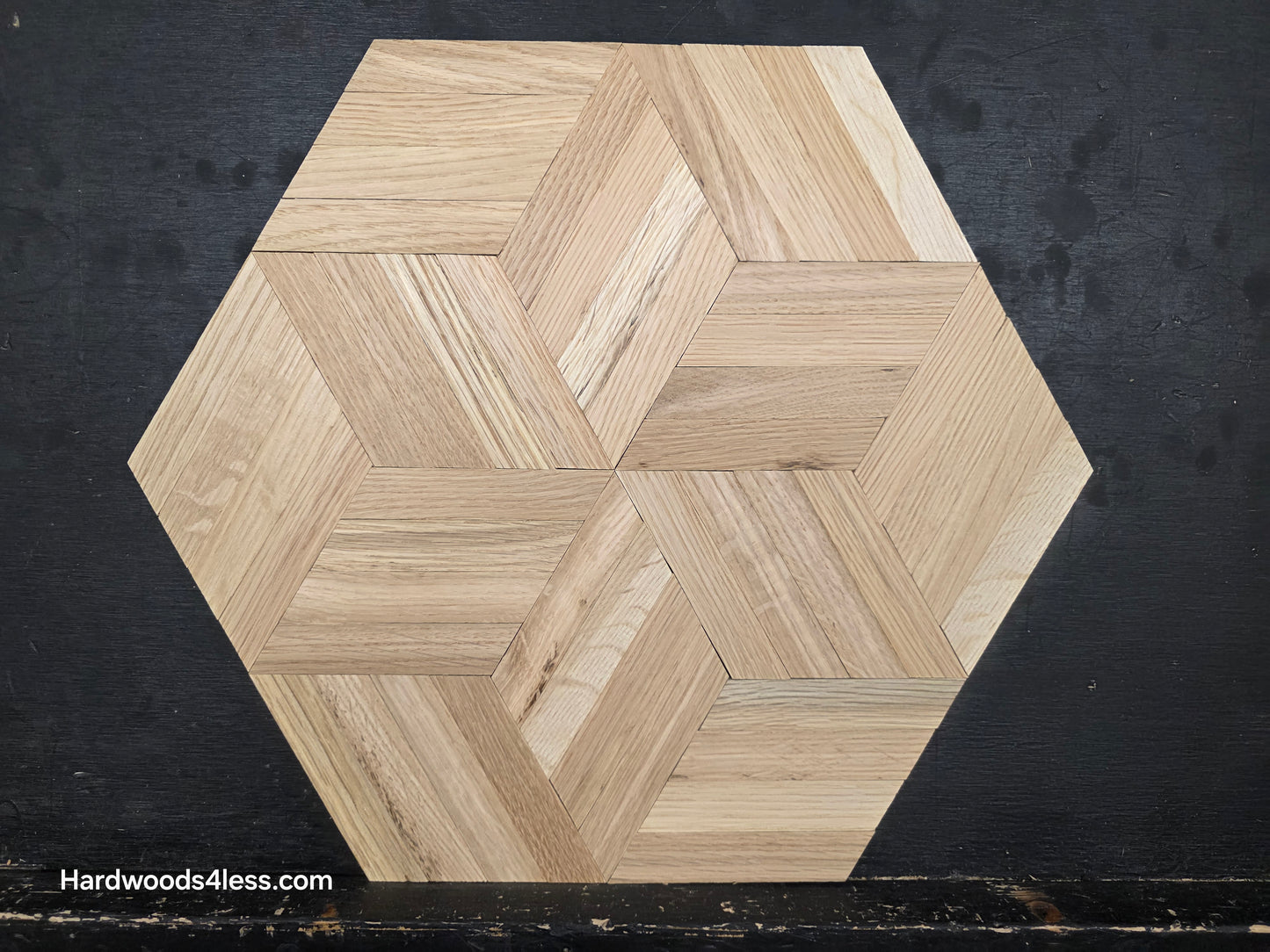15 1/8" x 15 1/8" x 5/16" Unfinished White Oak Rhombs Parquet Flooring. Shown on a black shooting table. close up on one tile.