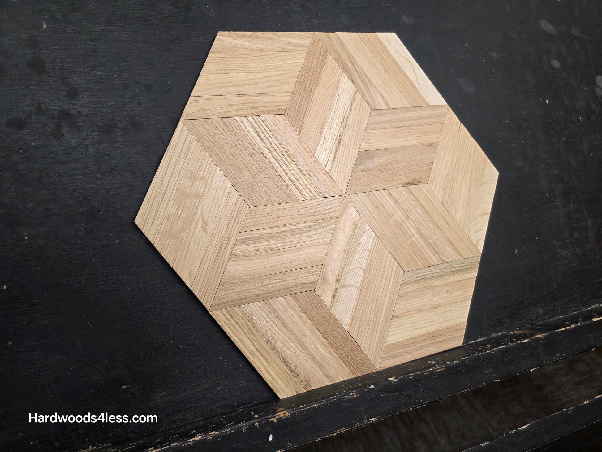 15 1/8" x 15 1/8" x 5/16" Unfinished White Oak Rhombs Parquet Flooring. Shown on a black shooting table. Shot close left as a single tile. 