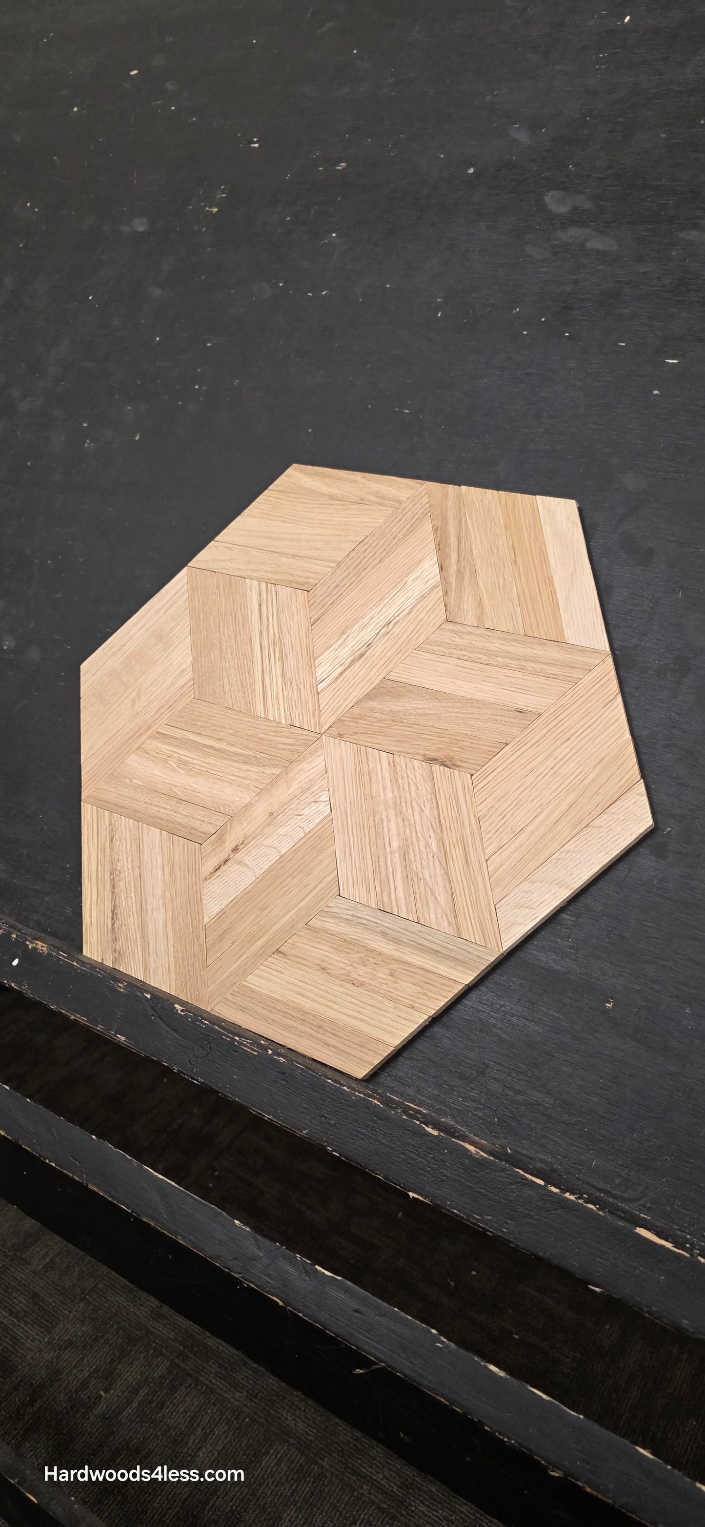 15 1/8" x 15 1/8" x 5/16" Unfinished White Oak Rhombs Parquet Flooring. Shown on a black shooting table. Wide right shot of one tile. 