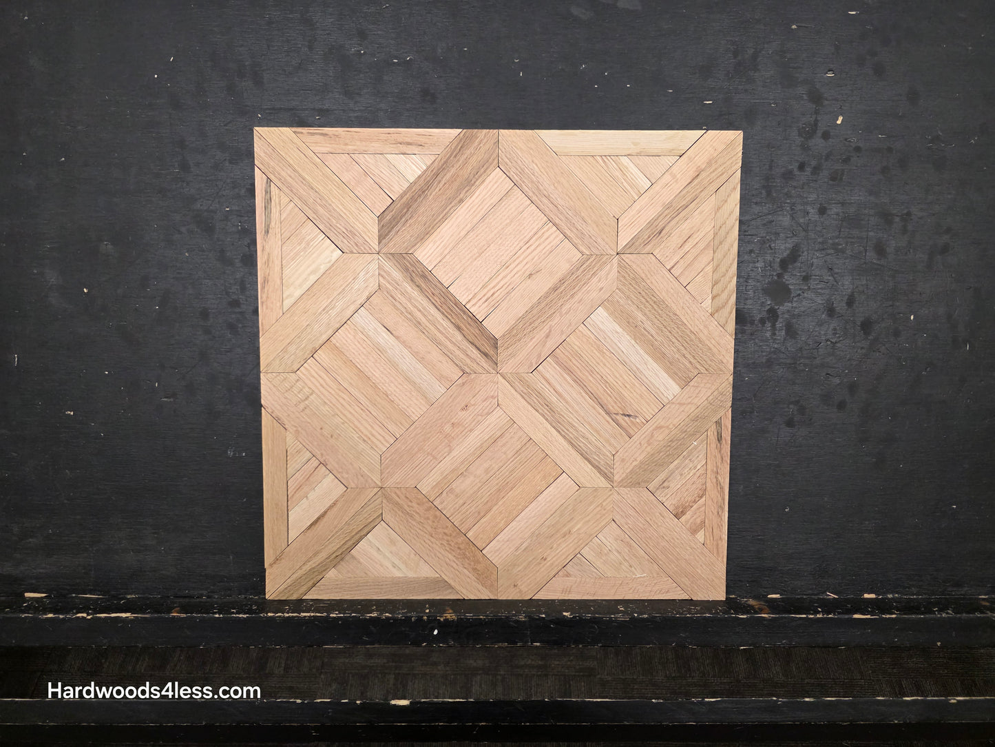 19" x 19" x 5/16" Unfinished White Oak Saxony Parquet Flooring. Shown on a black shooting table. Wide lens close up.