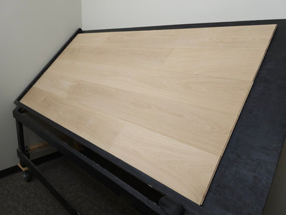 8 5/8" x 5/8" Engineered Unfinished European White Oak Select & Better Hardwood Flooring. Shown on a black shooting table. Shot from Wide right. 