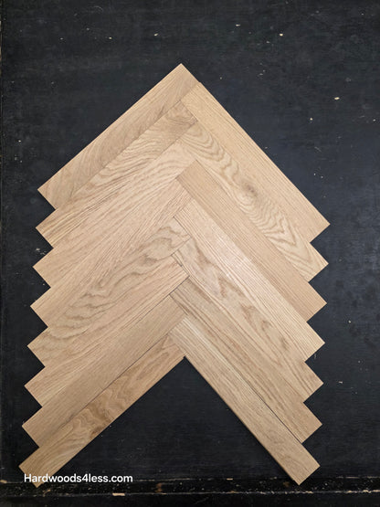 2 14 x 15.75 x 34 Solid Unfinished White Oak Herringbone Hardwood Flooring. Shown on a black shooting table. Shot from Center.