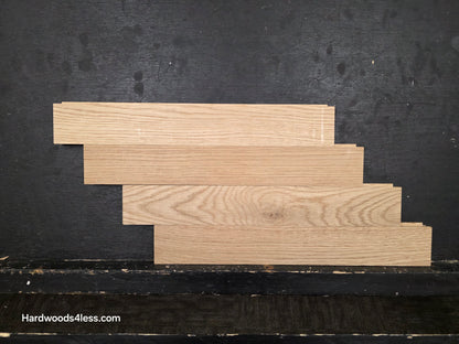 2 14 x 15.75 x 34 Solid Unfinished White Oak Herringbone Hardwood Flooring. Shown on a black shooting table. depicted as 4 planks stacked horizontally.