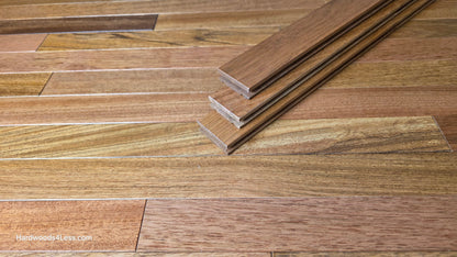 2 1/4" x 3/4" Brazilian Cherry Hardwood Flooring. Shown as three planks laid on top of the Brazilian Cherry flooring. 