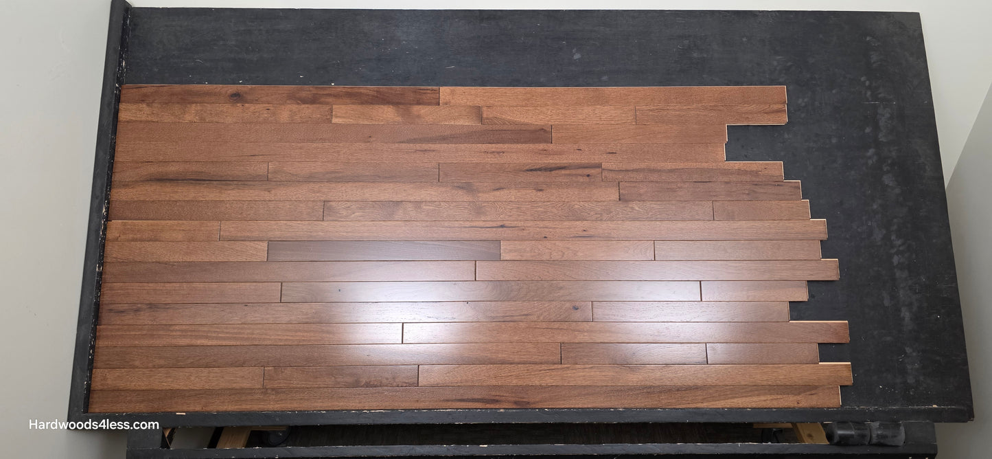 2 1/4" x 3/4" Hickory Nubuck Hardwood Flooring shown on a black shooting table. Shot from the center.