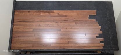 2 1/4" x 3/4" Hickory Nubuck Hardwood Flooring shown on a black shooting table. Shot from the center.